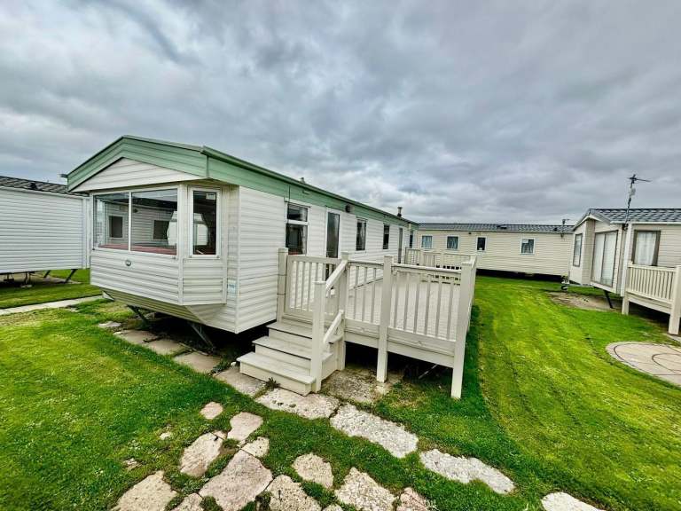 Static caravan under cloudy sky