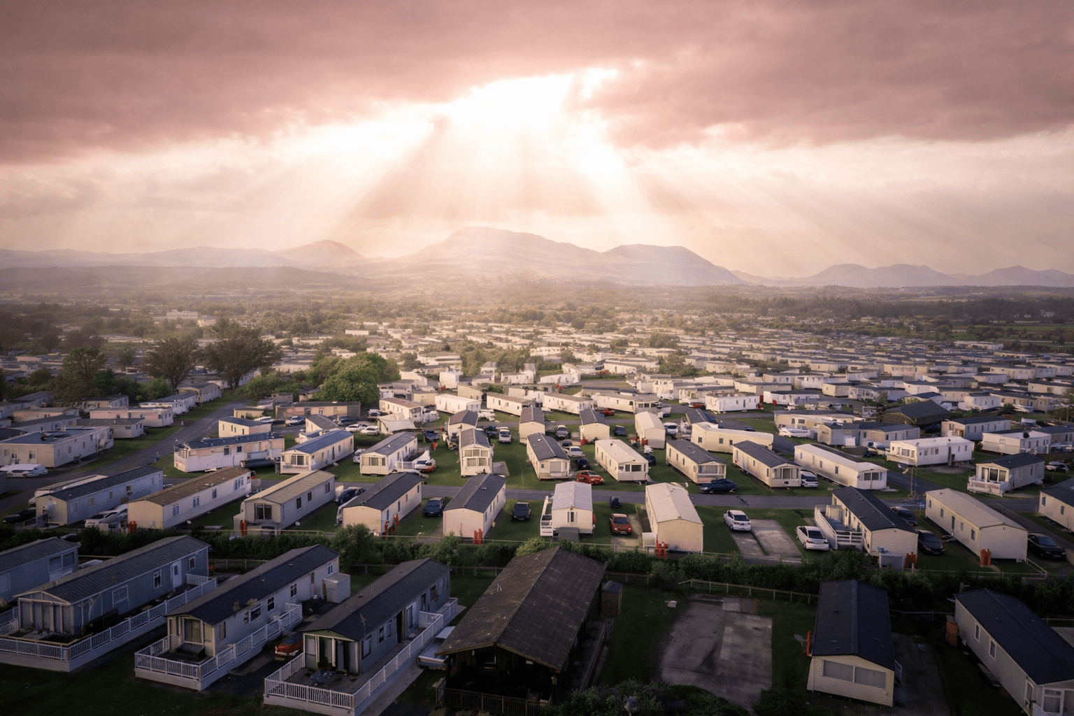 Dramatic aerial view of a large caravan park at sunset