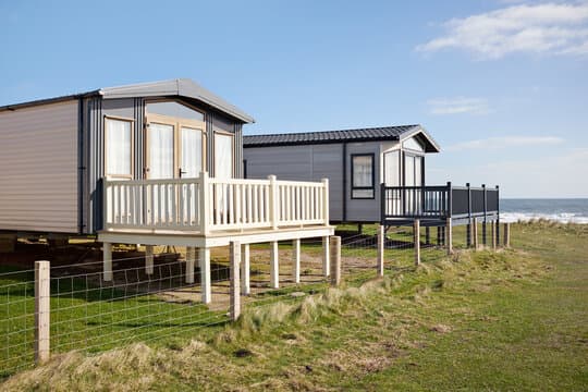Modern static caravans on a scenic coastal cliff