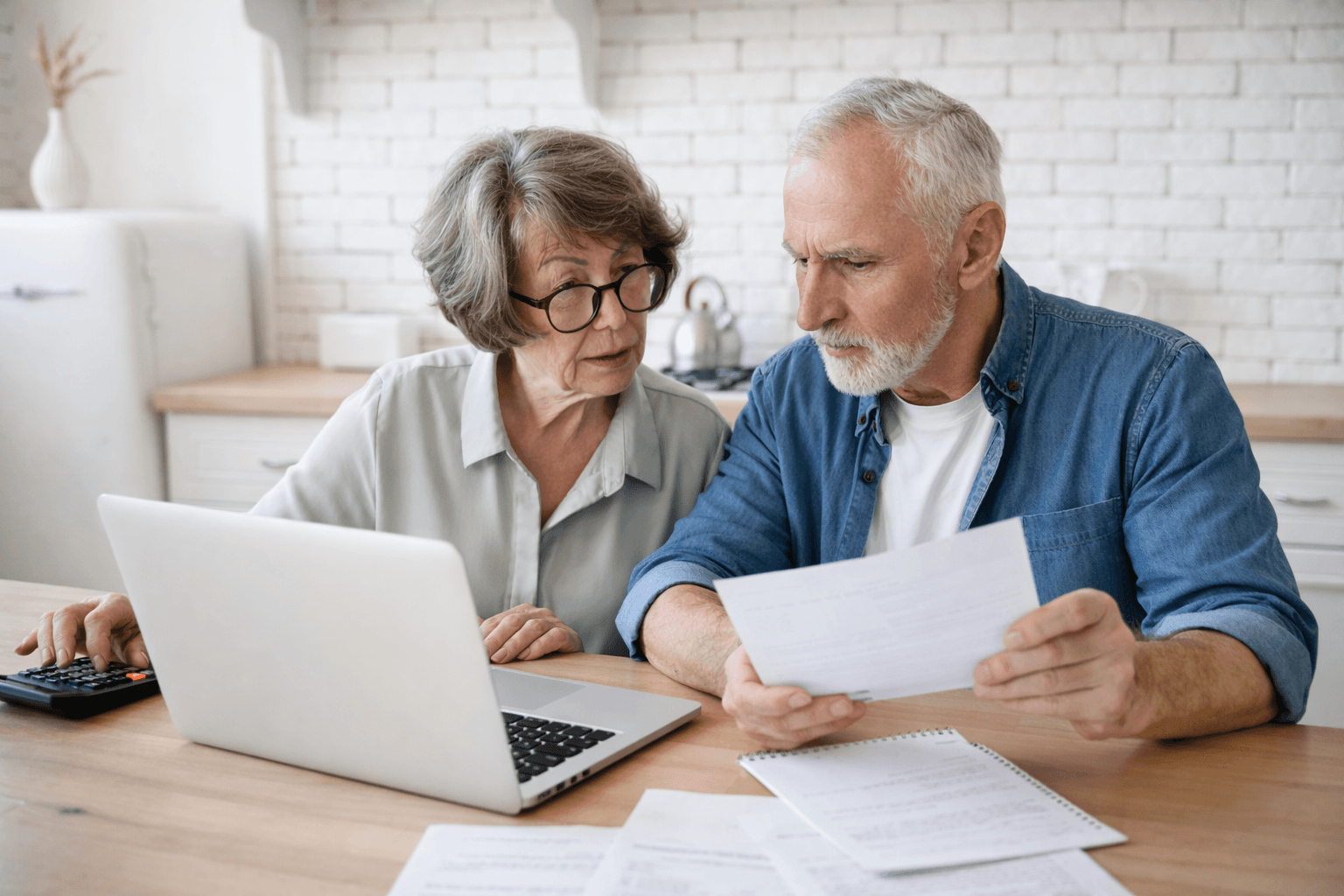 Couple reviewing paperwork and finances together